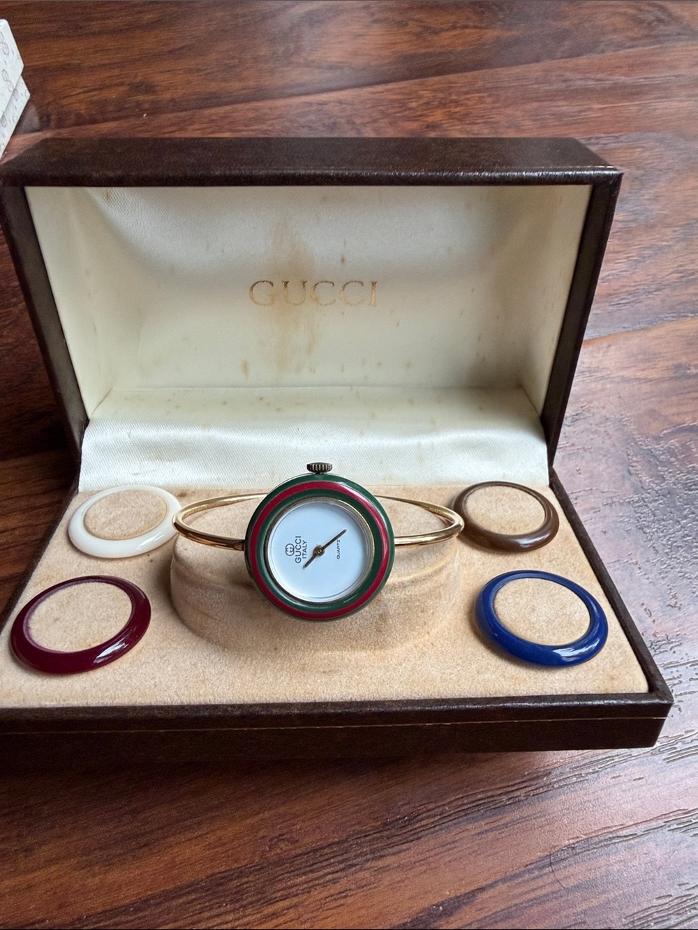 Gucci Gold-Tone Bangle Watch with Green and Red Bezel